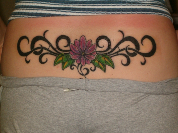 FlowerTribal lower back tattoo