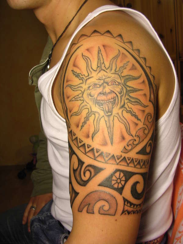 Smiling sun tattoo
