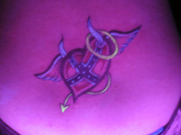 heart tattoo in black light ink tattoo