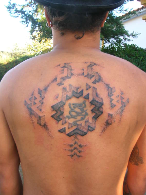 livings backpiece in portugal tattoo