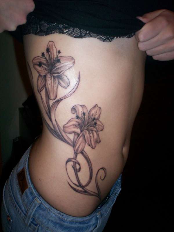 Lilies w/ stars - My first tattoo tattoo