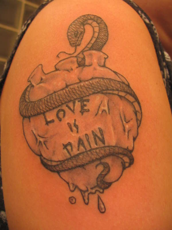 Love Is Pain Healed tattoo.