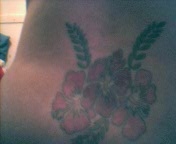 Pink hawaiian flowers tattoo
