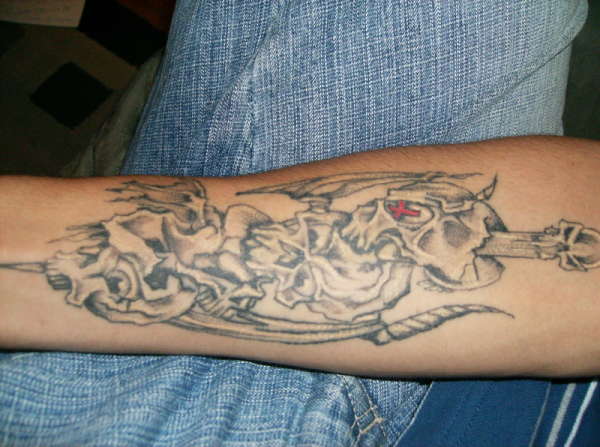 spiked skulls tattoo
