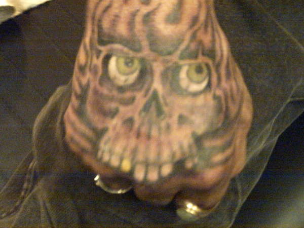 skull fist tattoo