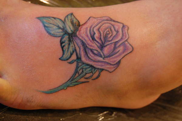 rose on foot tattoo