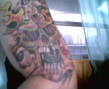 skulls with eyes and flames tattoo