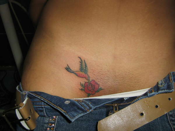 Hummingbird feeds tattoo