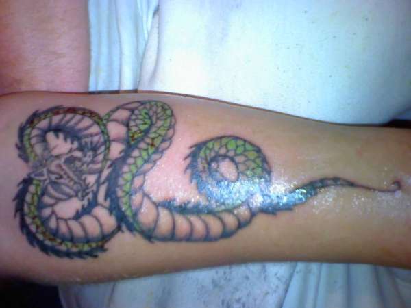 Custom dragon piece tattoo
