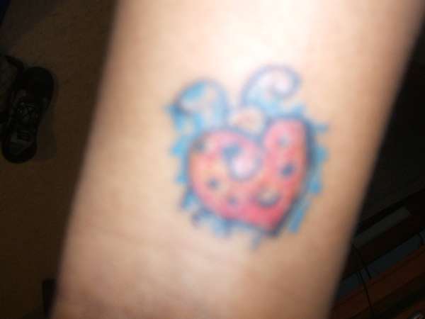 heart shaped ladybug tattoo