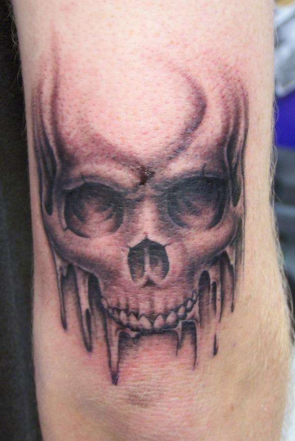 RON MEYERS, SKULL ABOVE ELBOW tattoo