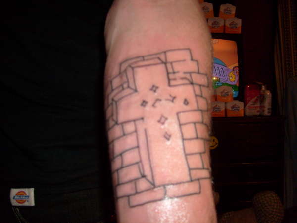 Cross on Bricks tattoo
