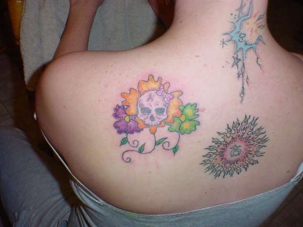 skull & flowers tattoo