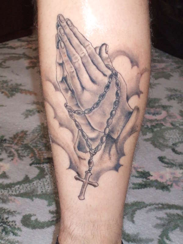 Praying hands tattoo