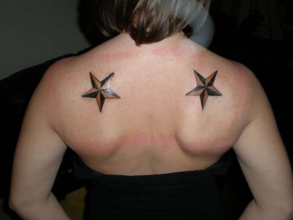 black and amber stars tattoo