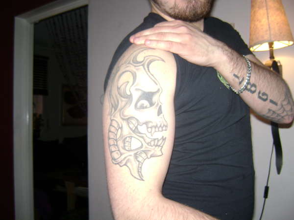 black and grey skull tattoo