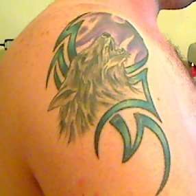 Wolf with a Moon & a Tribal tattoo