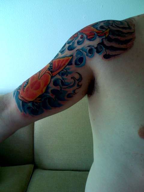 koi with waves and kanji tattoo