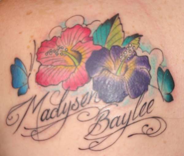 Hawaiian flowers and butterflies tattoo