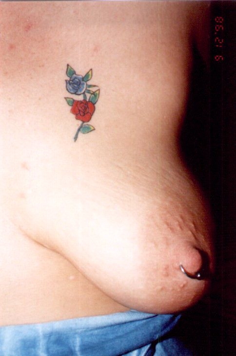 Rose boob tattoo