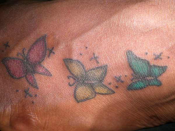 frolicing butterflies tattoo