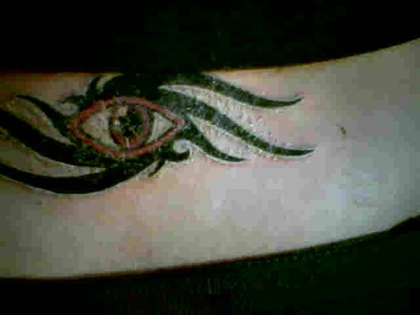 tribal eye tattoo