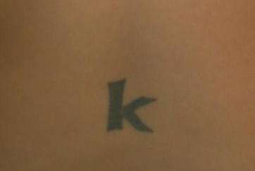 "K" tattoo