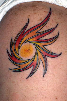 tribal sun tattoo