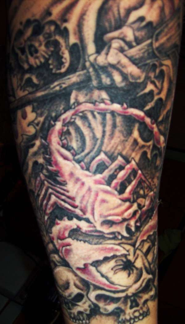 Scorpion on skulls tattoo