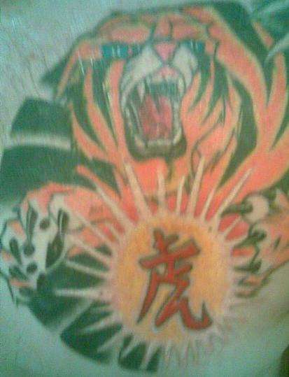 Jumping Tiger Catching Symbol tattoo