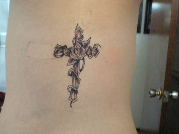 Cross and vines tattoo