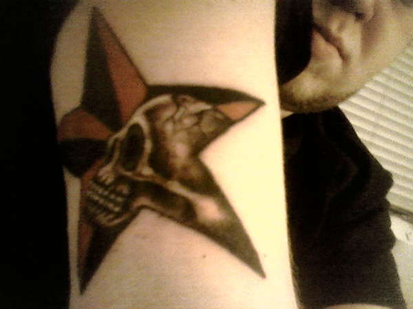 Skull/nautical star tattoo