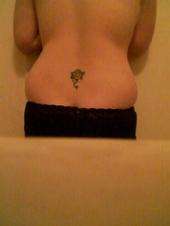 YELLOW ROSE ON MY LOWERBACK tattoo