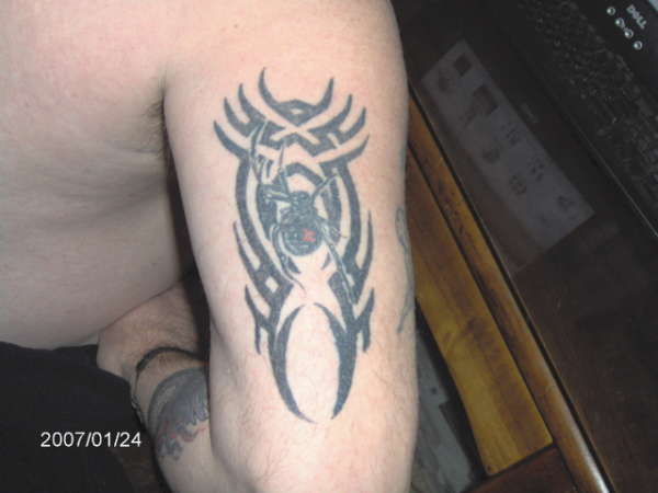 tribal black widow tattoo