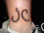 Fish hooks... My initials... JC tattoo