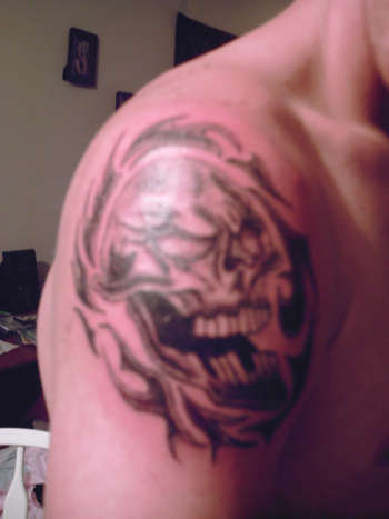 Skull With Tribal tattoo
