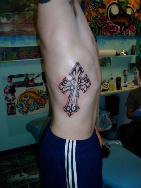 cross tattoos on side of ribs