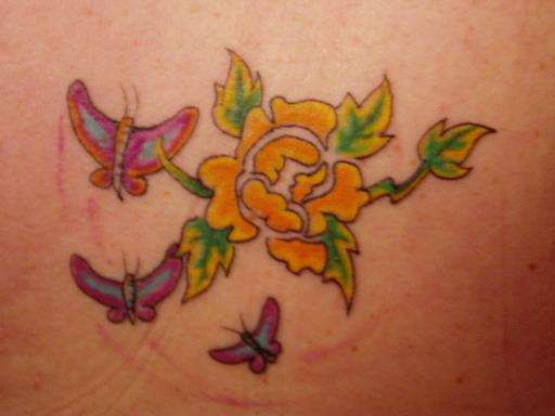 flower and butterflies tattoo