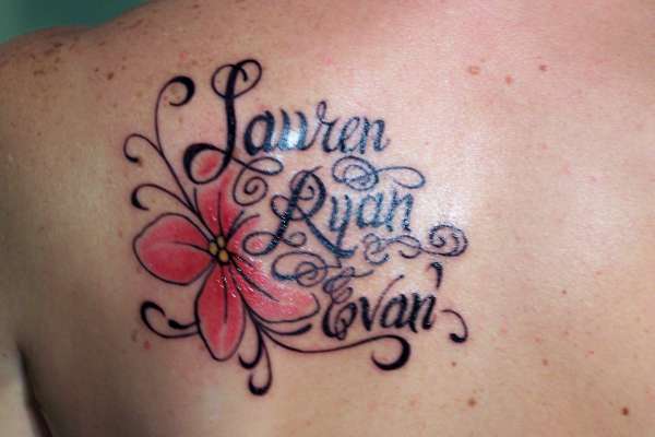 Flower with kids names tattoo