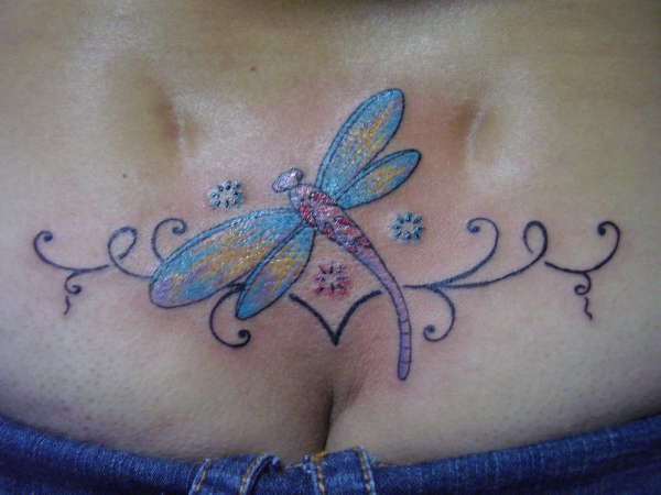 dragonfly in  a lower back tattoo