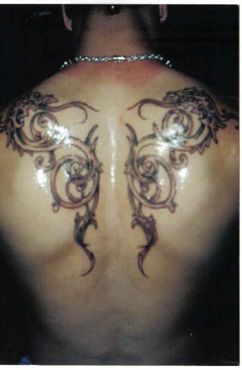 Double Dragon Tribal tattoo