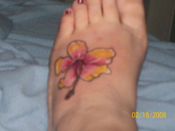 hibiscus ontop of my foot tattoo