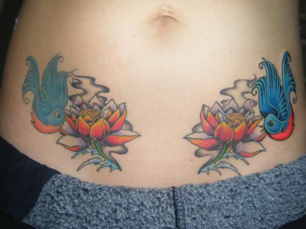 lotus + reinked bluebird tattoo