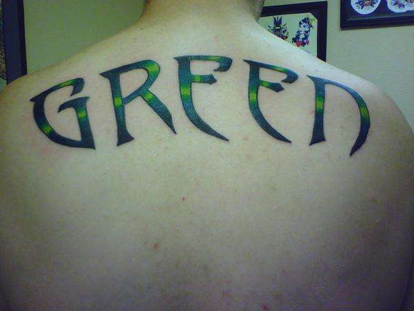 Last name on my back tattoo