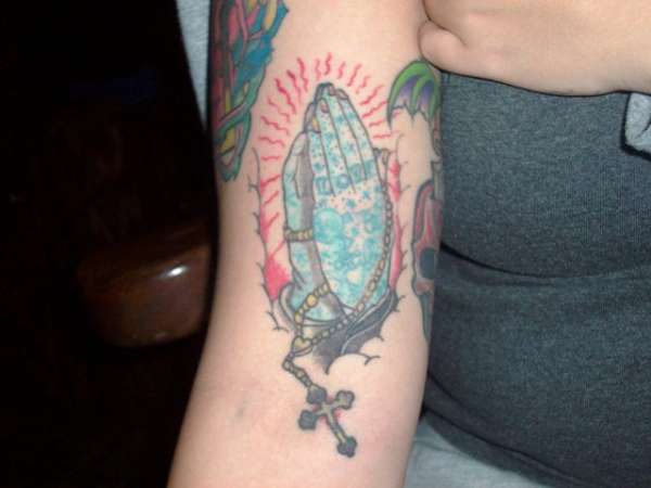 tattooed praying hands tattoo