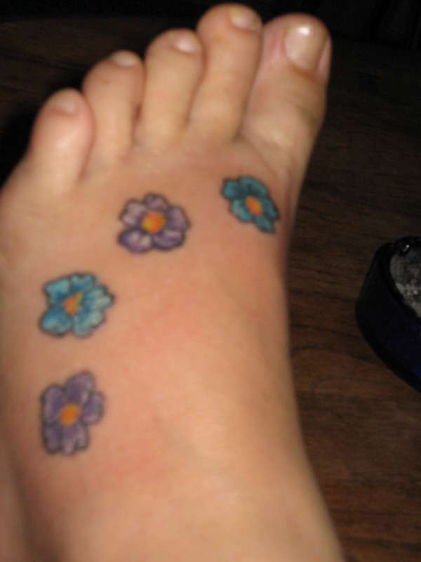 Flowers on foot tattoo