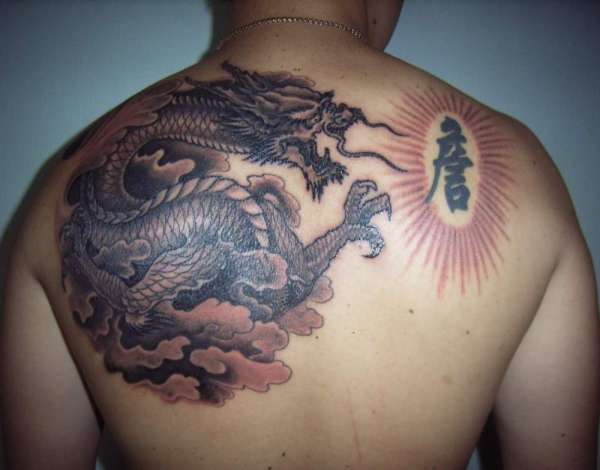 black & grey Dragon tattoo