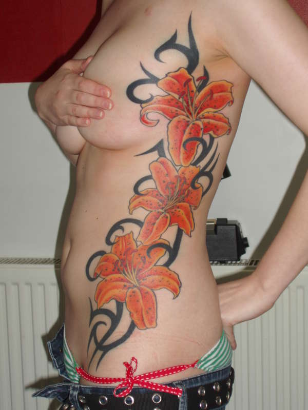 lillies down side tattoo