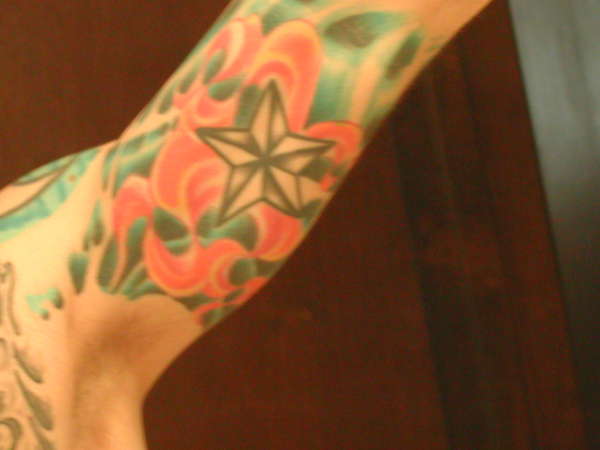 under right arm tattoo