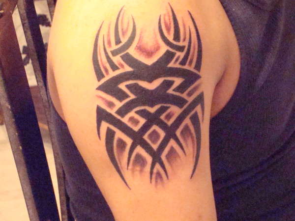 tribal  with shadows tattoo